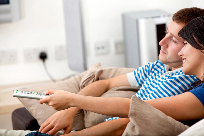 Loving couple at home relaxing watching tv-1